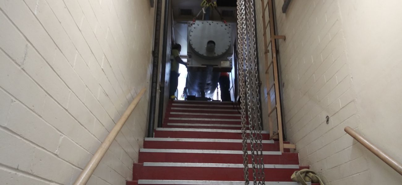 Chiller tank going down the stairs