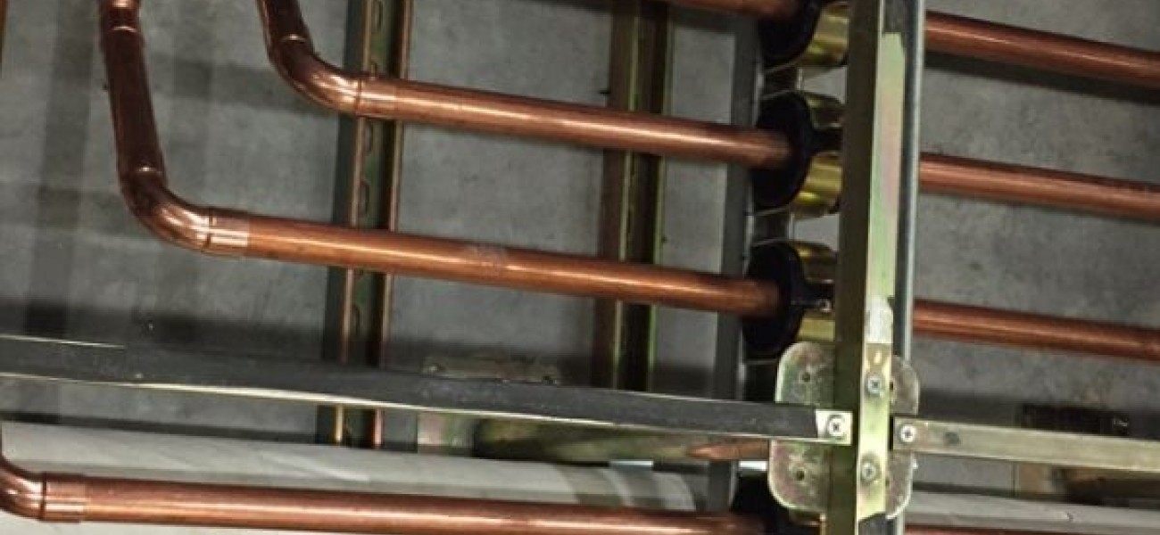 Close up image of underfloor piping Close up image of underfloor piping