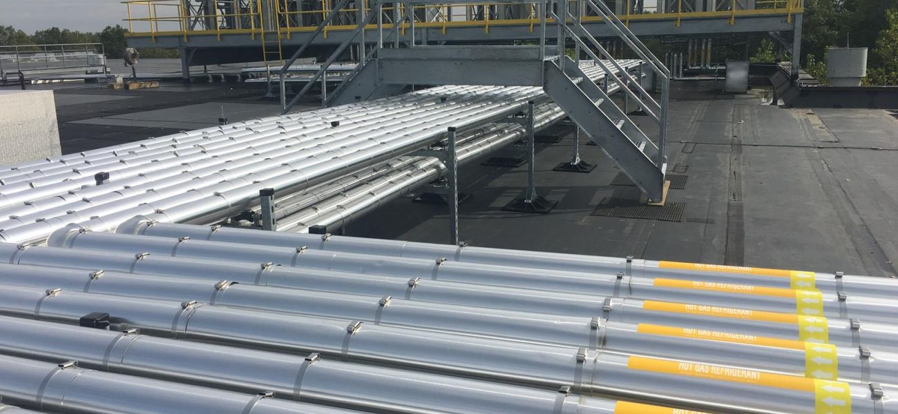 Refrigerant piping on top of roof Refrigerant piping on top of roof